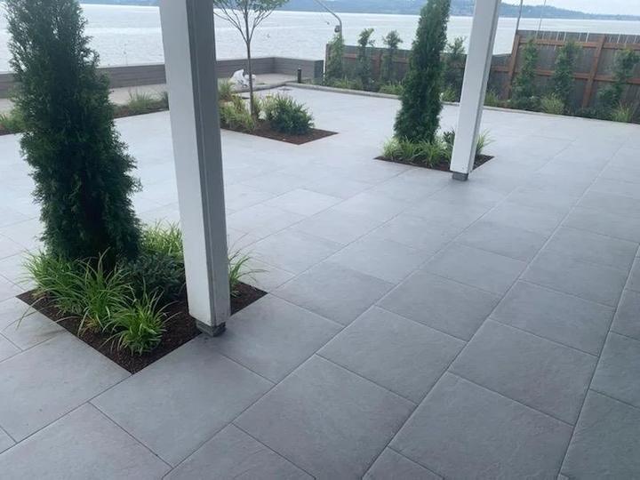 Porcelain pavers around a covered patio